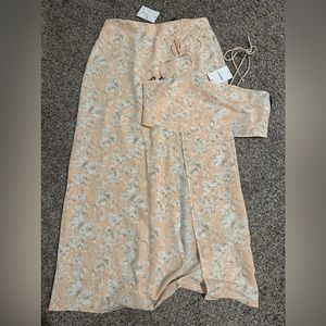 Two piece set. New with Tags and never worn! Fits like a L/XL